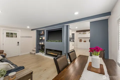 a living room with furniture and flowers