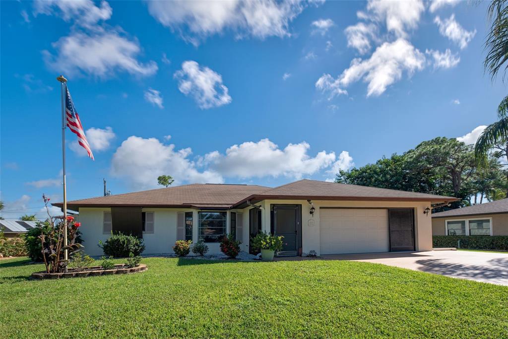 5923 Elton Road Venice, FL 34293 - Photo 1 of 1 a view of a house with a yard and pathway