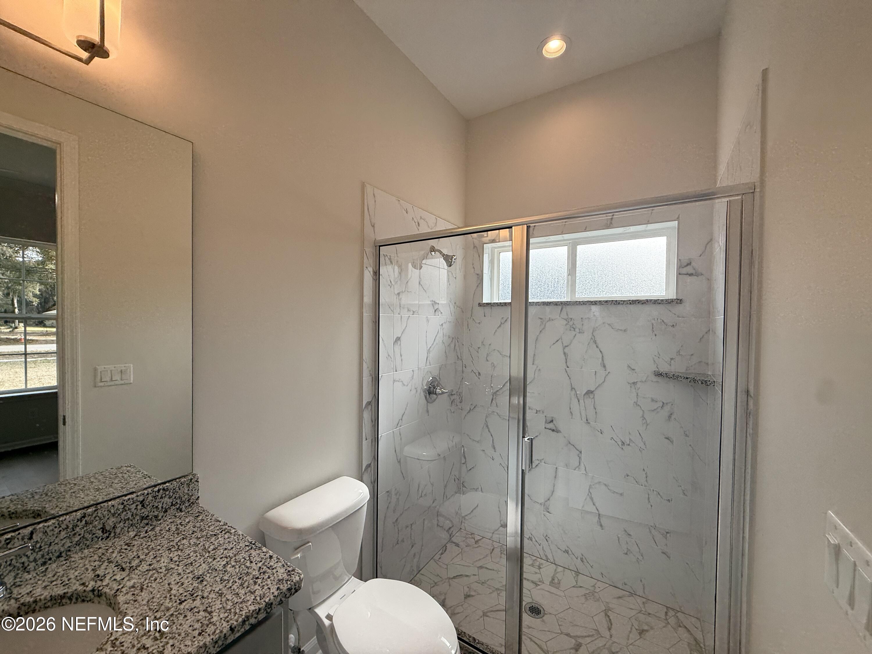 95110 Barnwell Road Fernandina Beach, FL 32034 - Photo 12 of 22 a bathroom with a shower toilet and sink