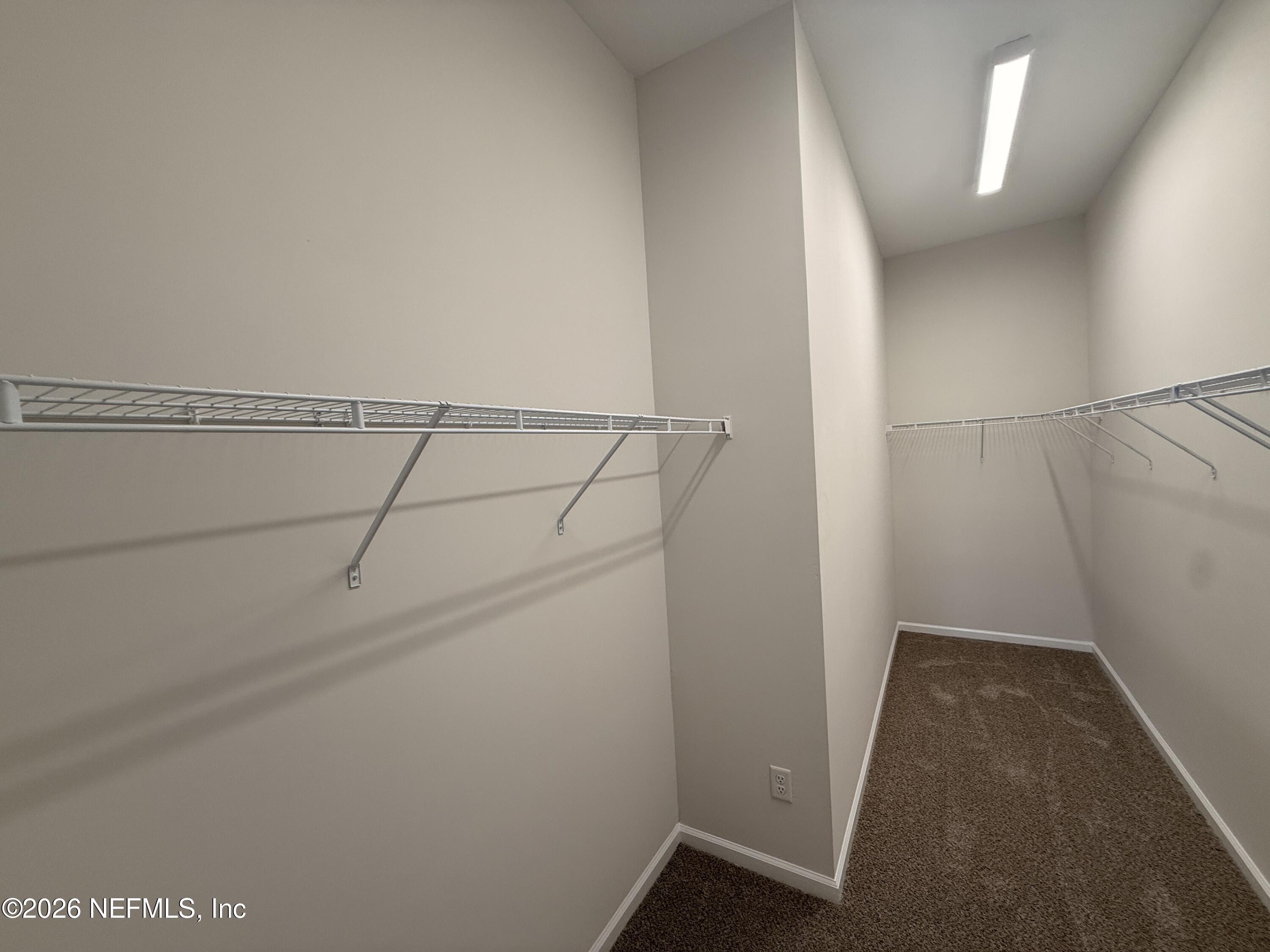 95110 Barnwell Road Fernandina Beach, FL 32034 - Photo 18 of 22 a view of a room with racks on the wall