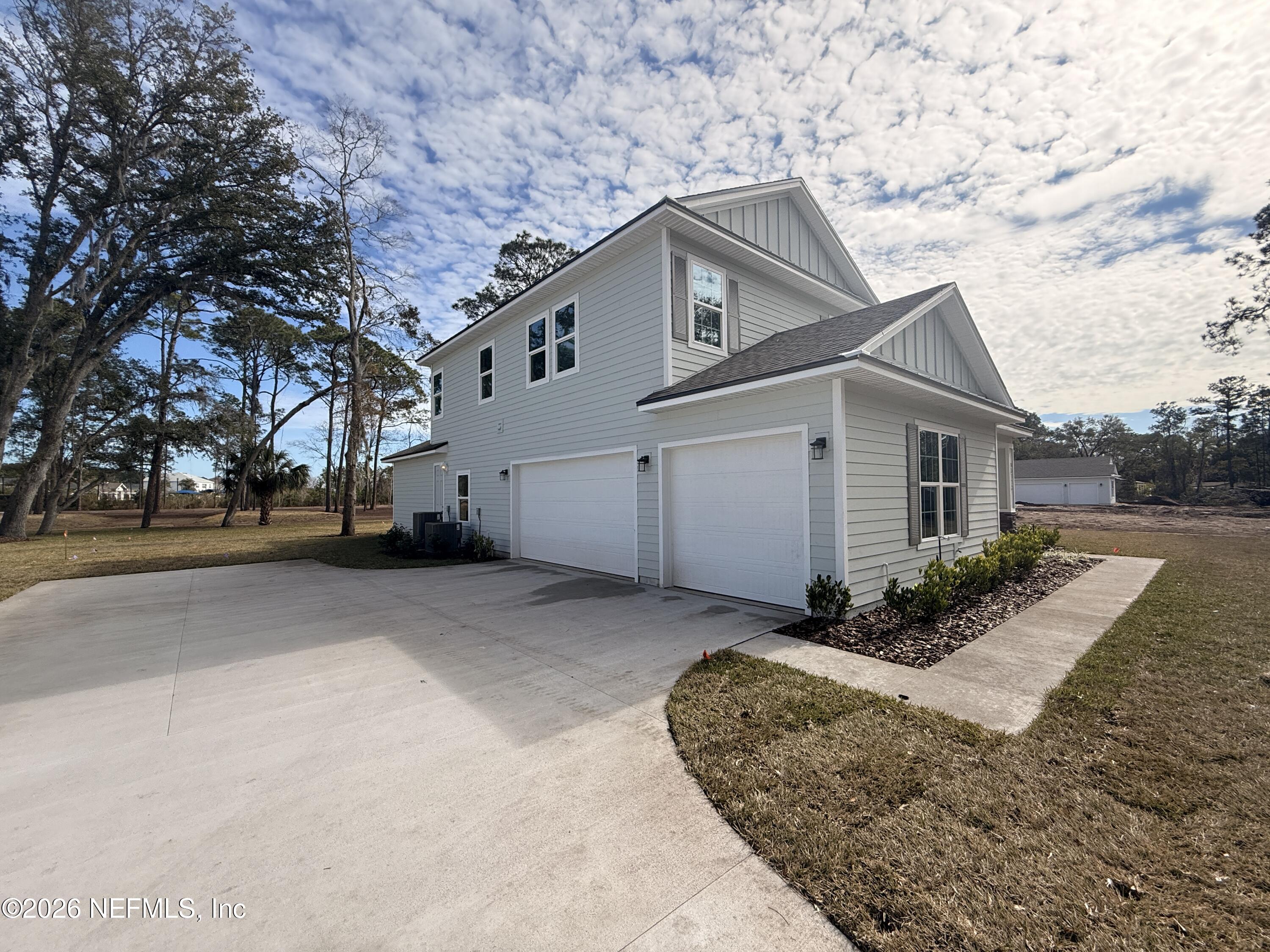 95110 Barnwell Road Fernandina Beach, FL 32034 - Photo 2 of 22 a view of a house with a yard