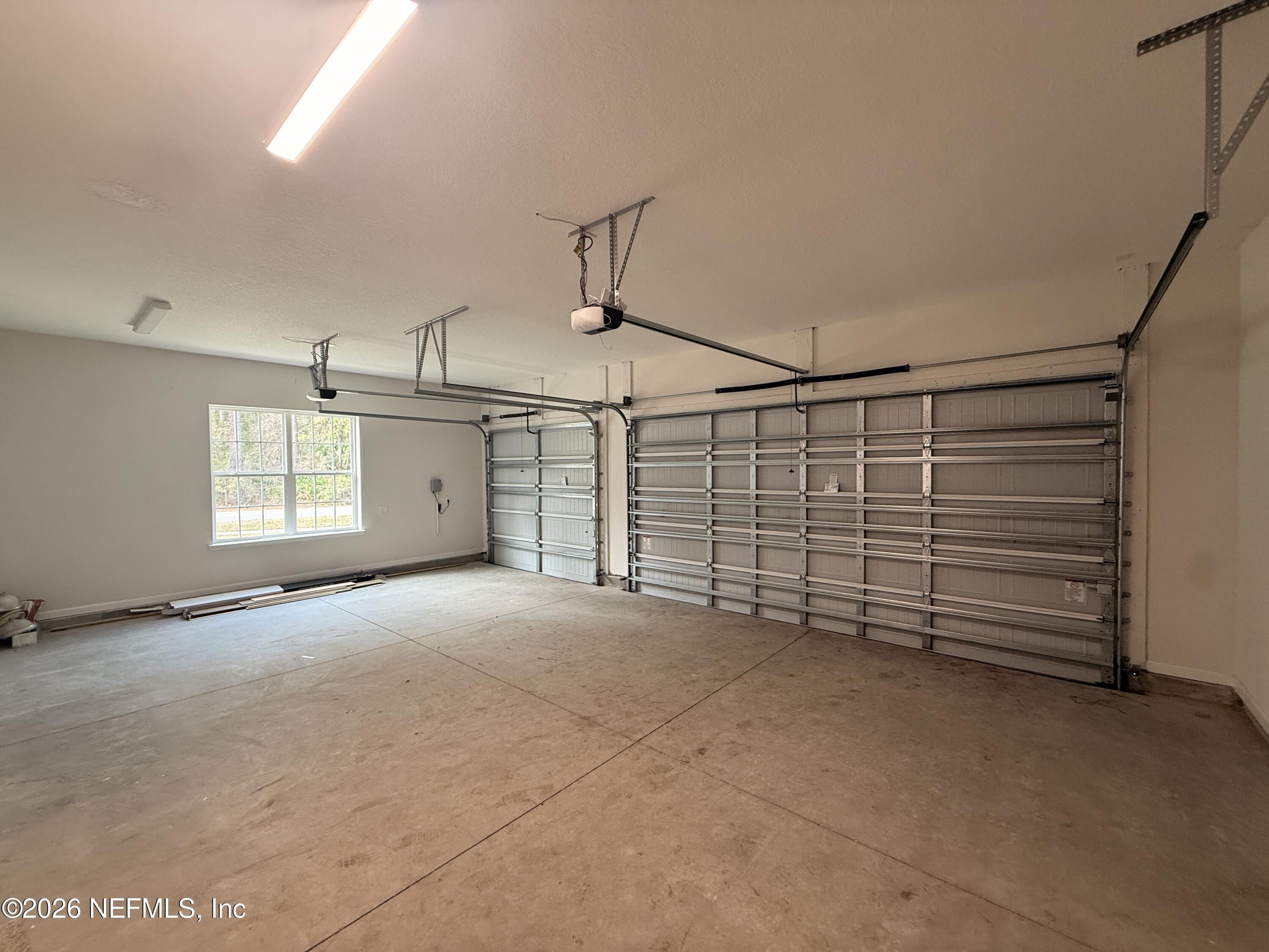 95110 Barnwell Road Fernandina Beach, FL 32034 - Photo 21 of 22 a view of a garage with window