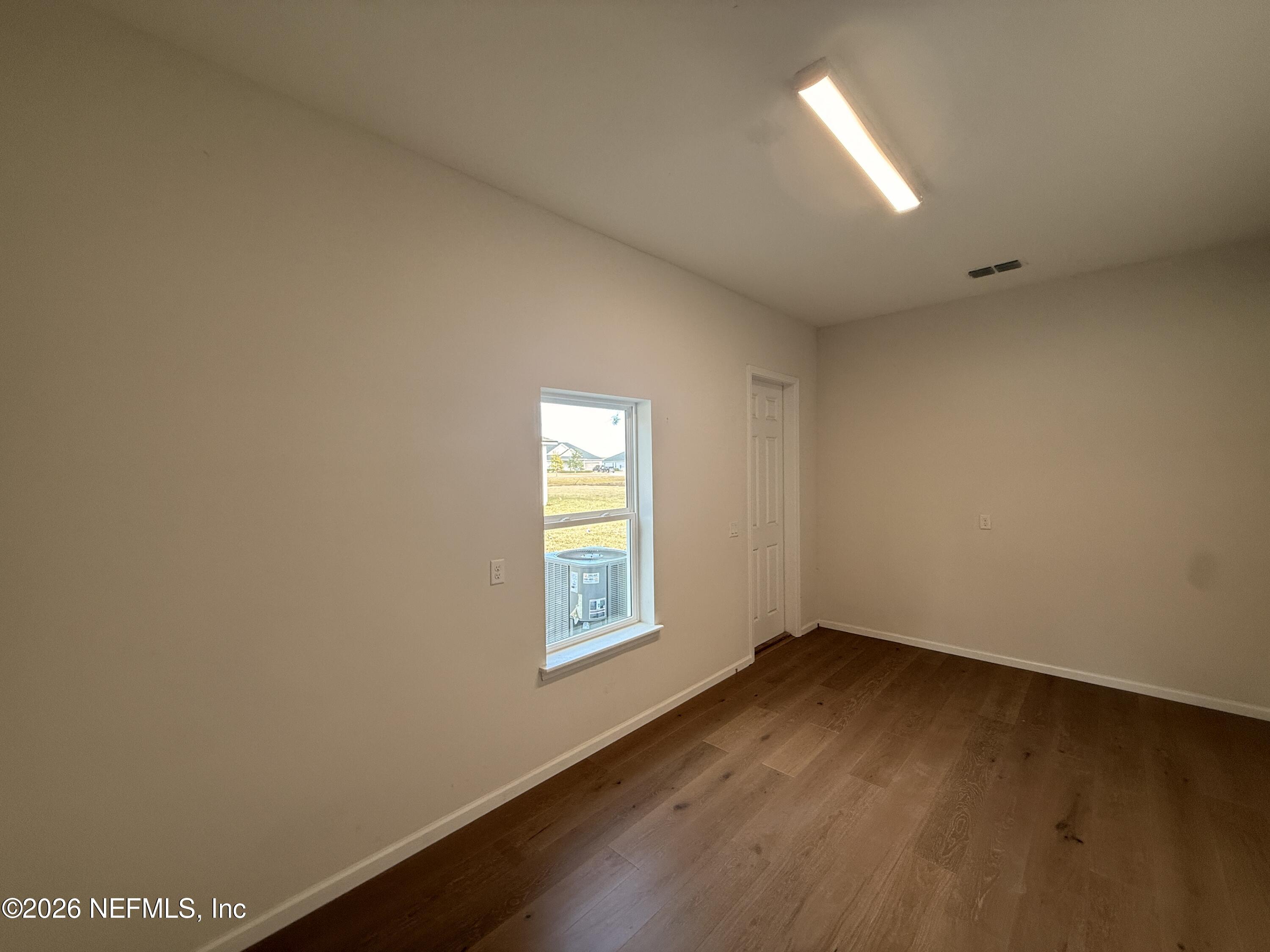 95110 Barnwell Road Fernandina Beach, FL 32034 - Photo 22 of 22 an empty room with a window
