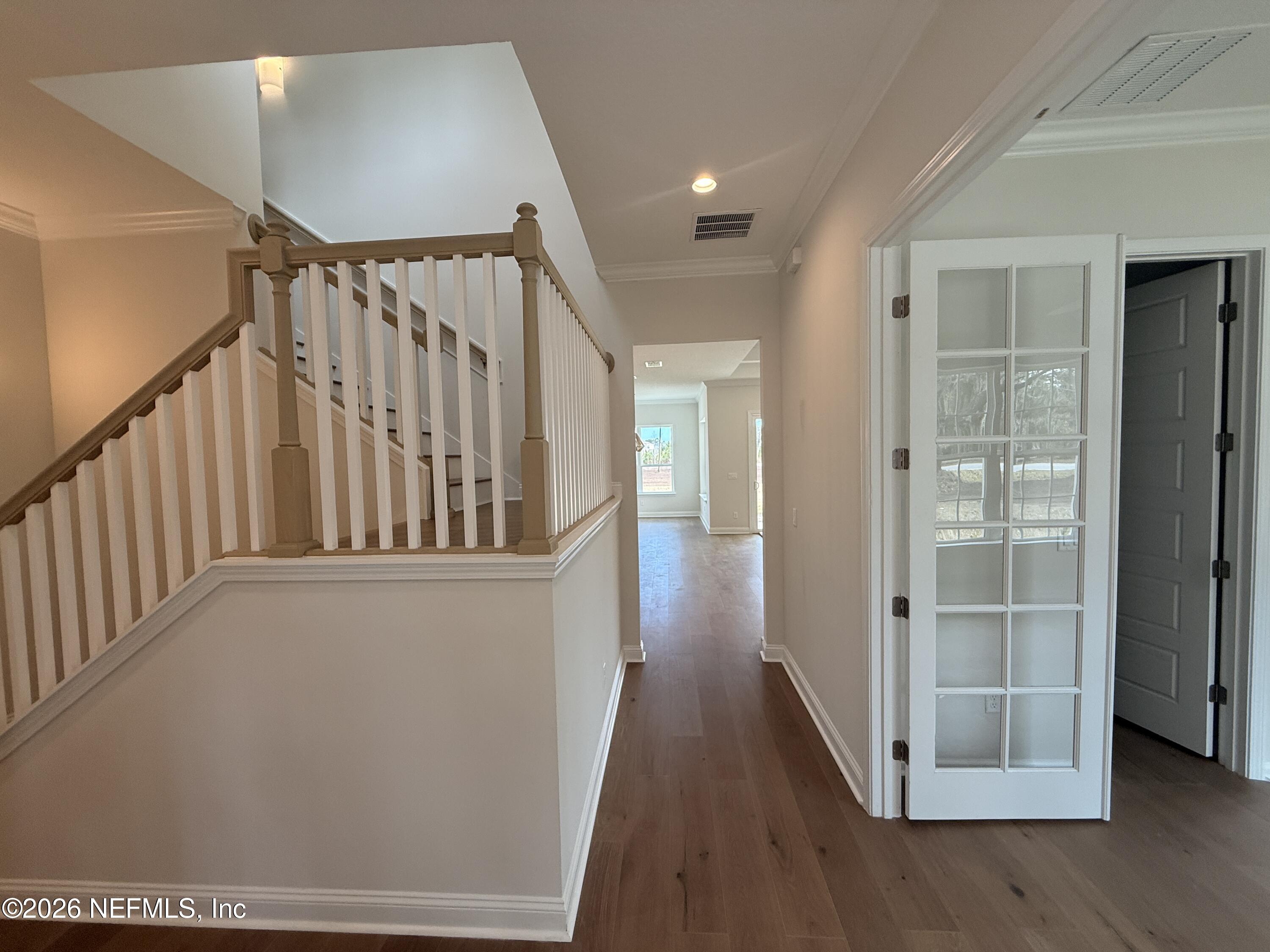 95110 Barnwell Road Fernandina Beach, FL 32034 - Photo 5 of 22 a view of staircase with wooden floor and stairs
