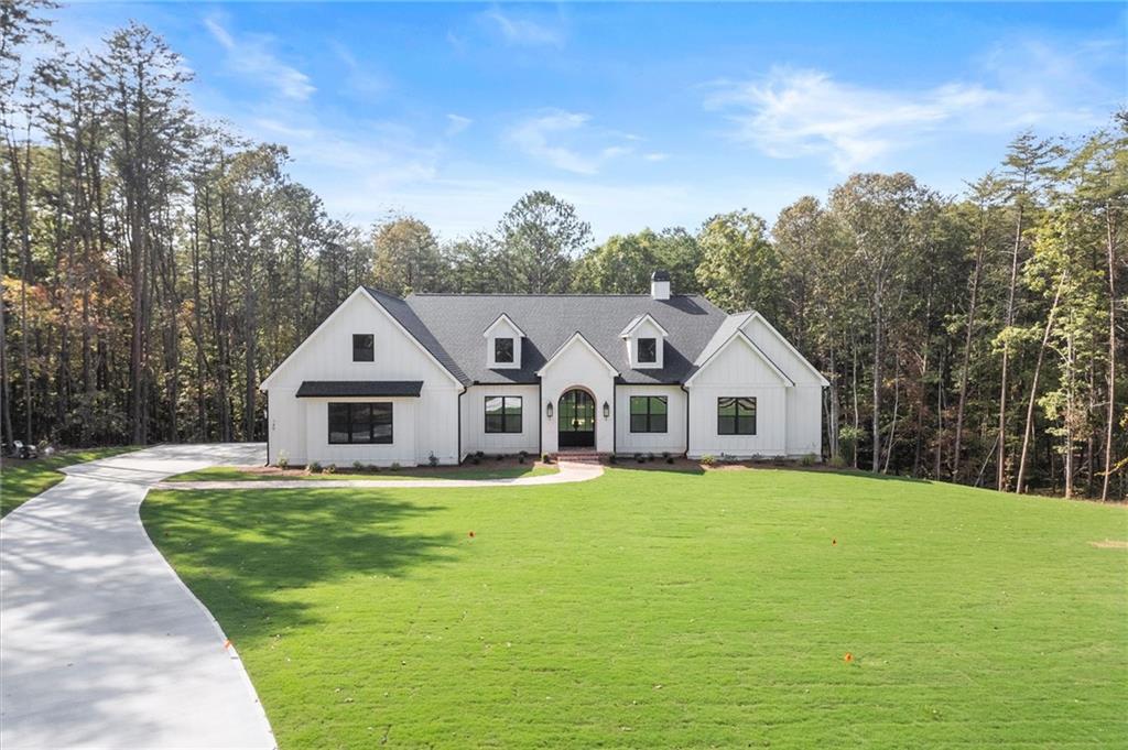 145 Highlands Chase Ball Ground, GA 30107 - Photo 1 of 79 a view of a house with a yard