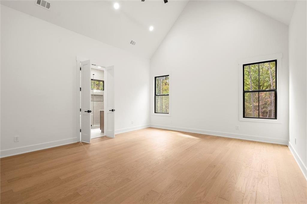 145 Highlands Chase Ball Ground, GA 30107 - Photo 31 of 79 wooden floor in an empty room with a window