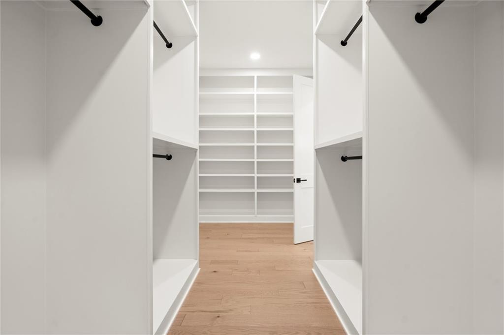 145 Highlands Chase Ball Ground, GA 30107 - Photo 36 of 79 a view of walk in closet with empty racks