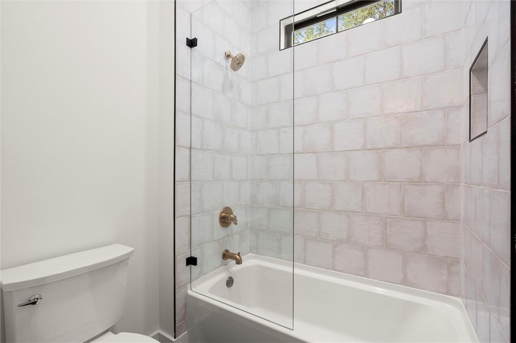 145 Highlands Chase Ball Ground, GA 30107 - Photo 45 of 79 a bathroom with a bathtub and toilet