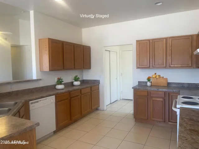 a kitchen with cabinets and window