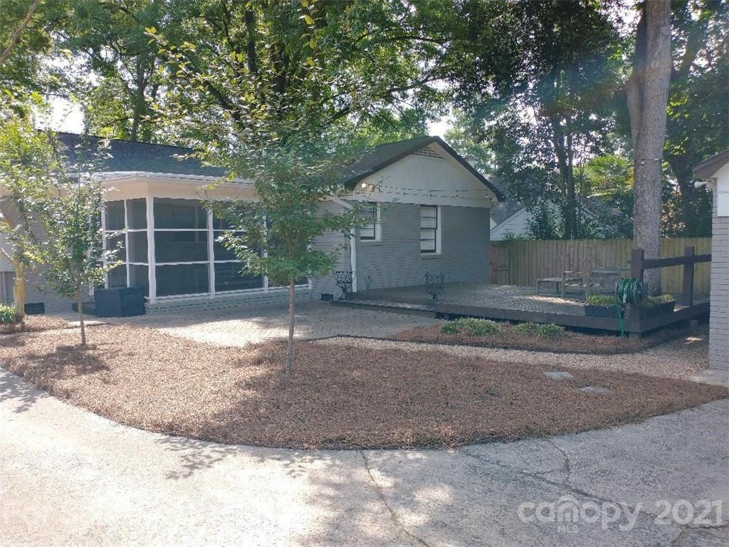 3634 Park Road Charlotte, NC 28209 - Photo 2 of 15 a front view of a house with a yard and garage