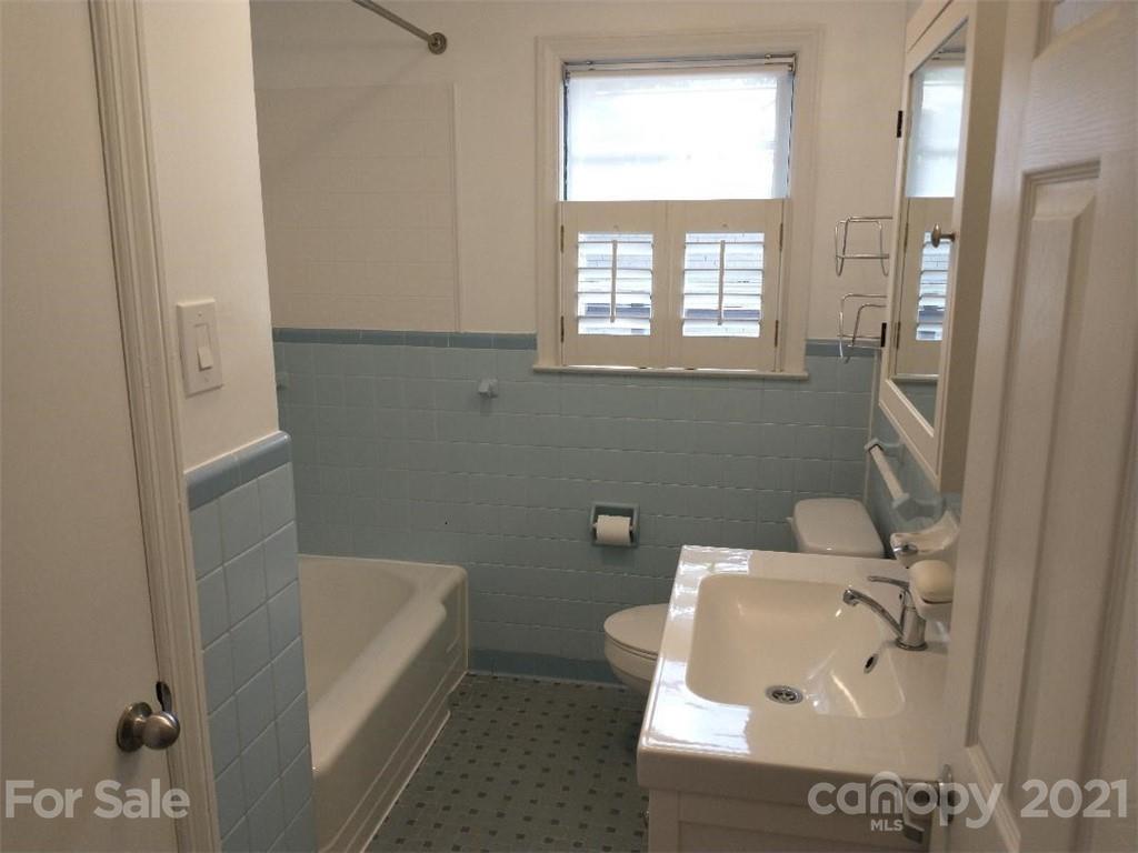 3634 Park Road Charlotte, NC 28209 - Photo 14 of 15 a bathroom with a sink and bathtub with shower