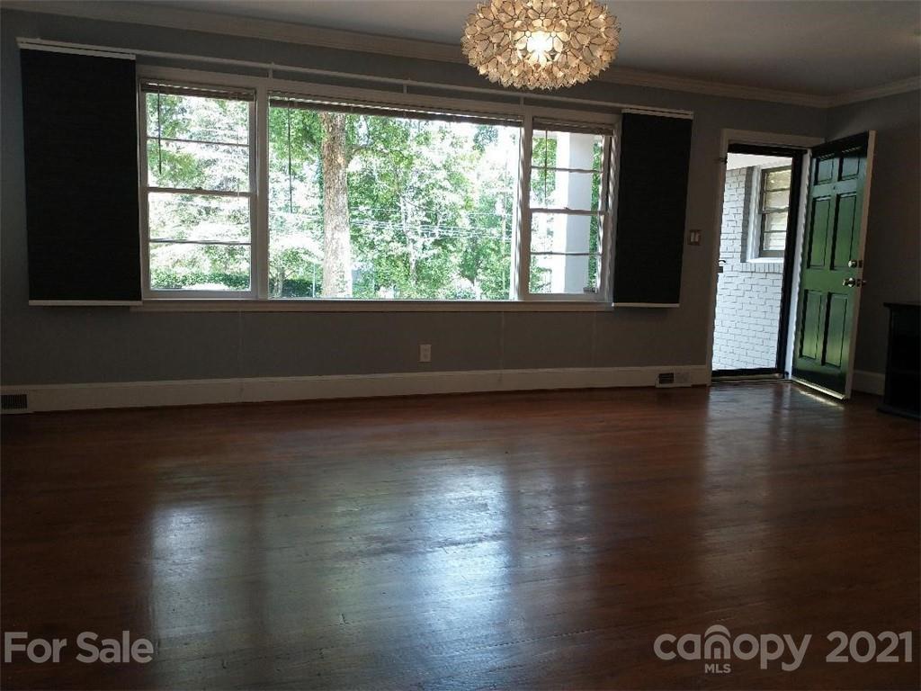 3634 Park Road Charlotte, NC 28209 - Photo 4 of 15 a view of room with window and wooden floor
