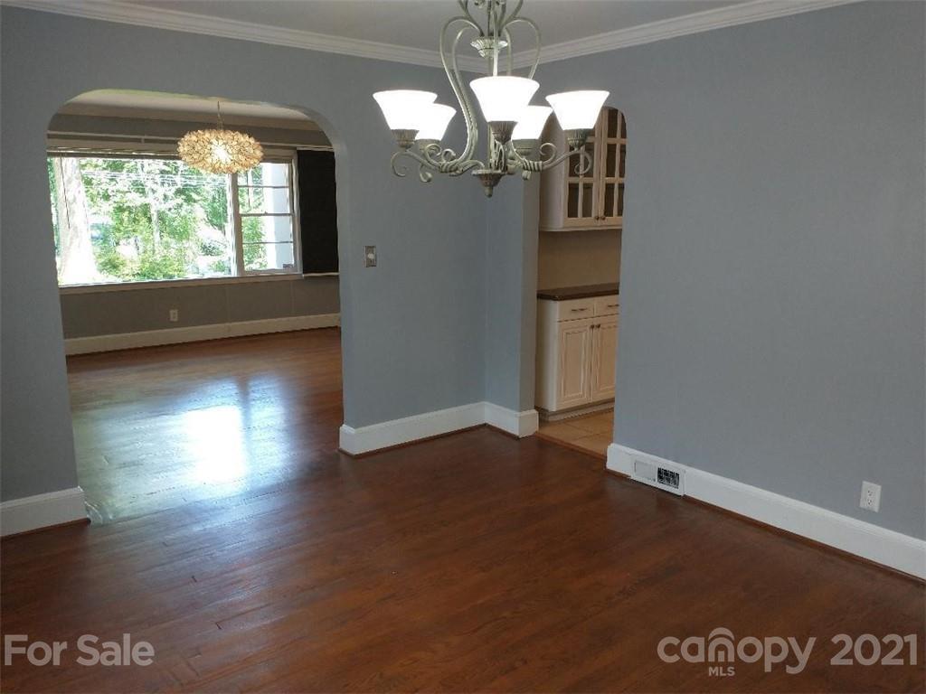 3634 Park Road Charlotte, NC 28209 - Photo 5 of 15 an empty room with wooden floor and windows