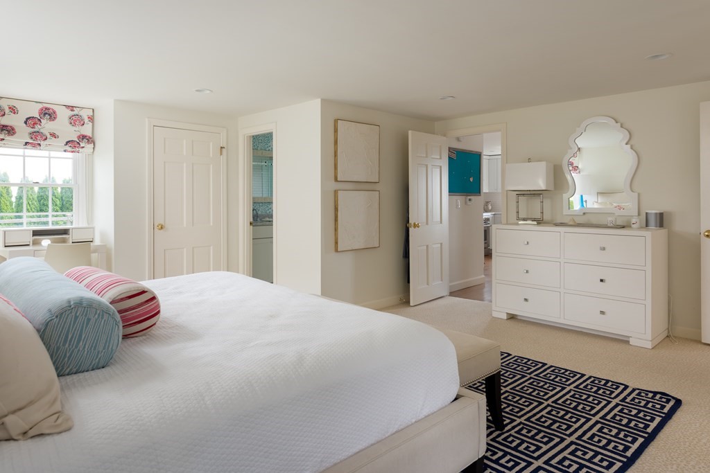 25 Davis Lane Harwich, MA 02646 - Photo 13 of 21 a bedroom with a large bed and a dresser