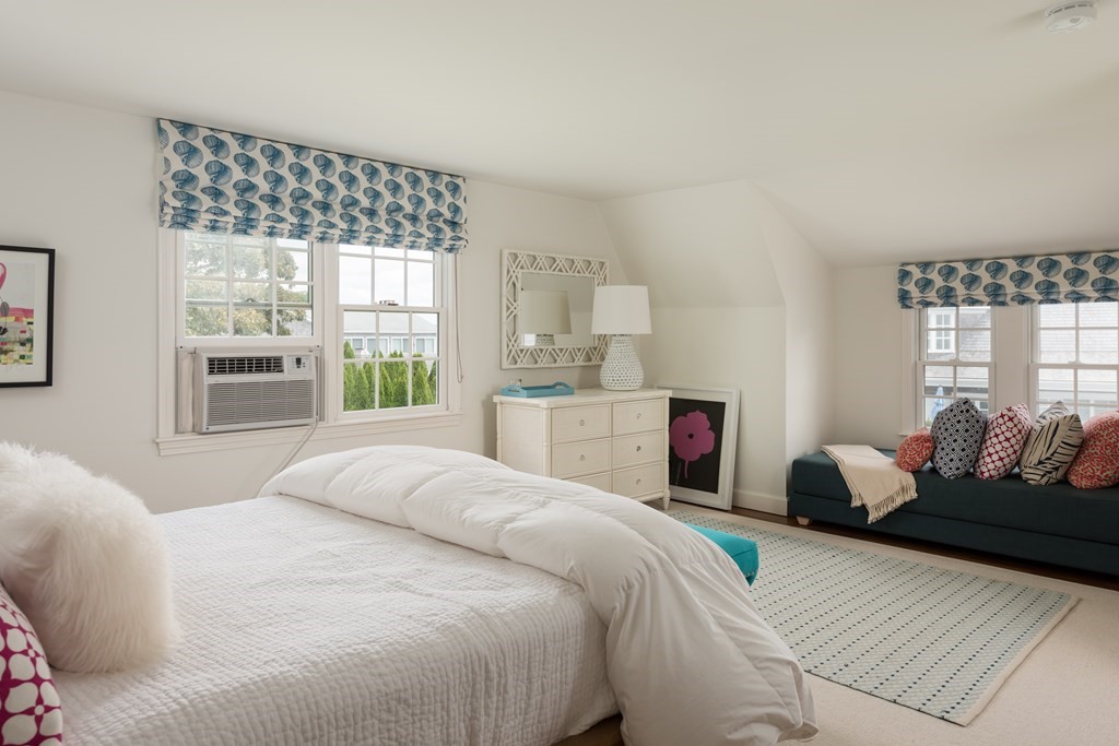 25 Davis Lane Harwich, MA 02646 - Photo 18 of 21 a bedroom with a bed and wooden floor