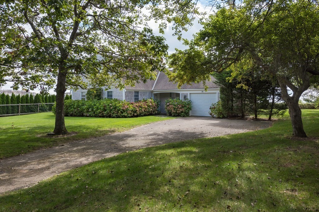 25 Davis Lane Harwich, MA 02646 - Photo 3 of 21 a view of a yard in front of a house