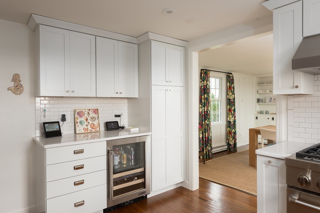 25 Davis Lane Harwich, MA 02646 - Photo 10 of 21 a kitchen with stainless steel appliances a stove and a refrigerator