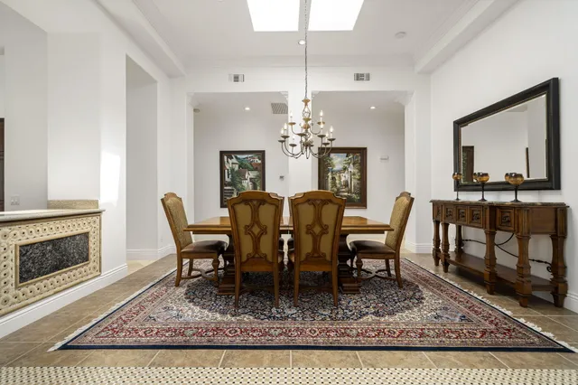 a bedroom with bed and painting on the wall