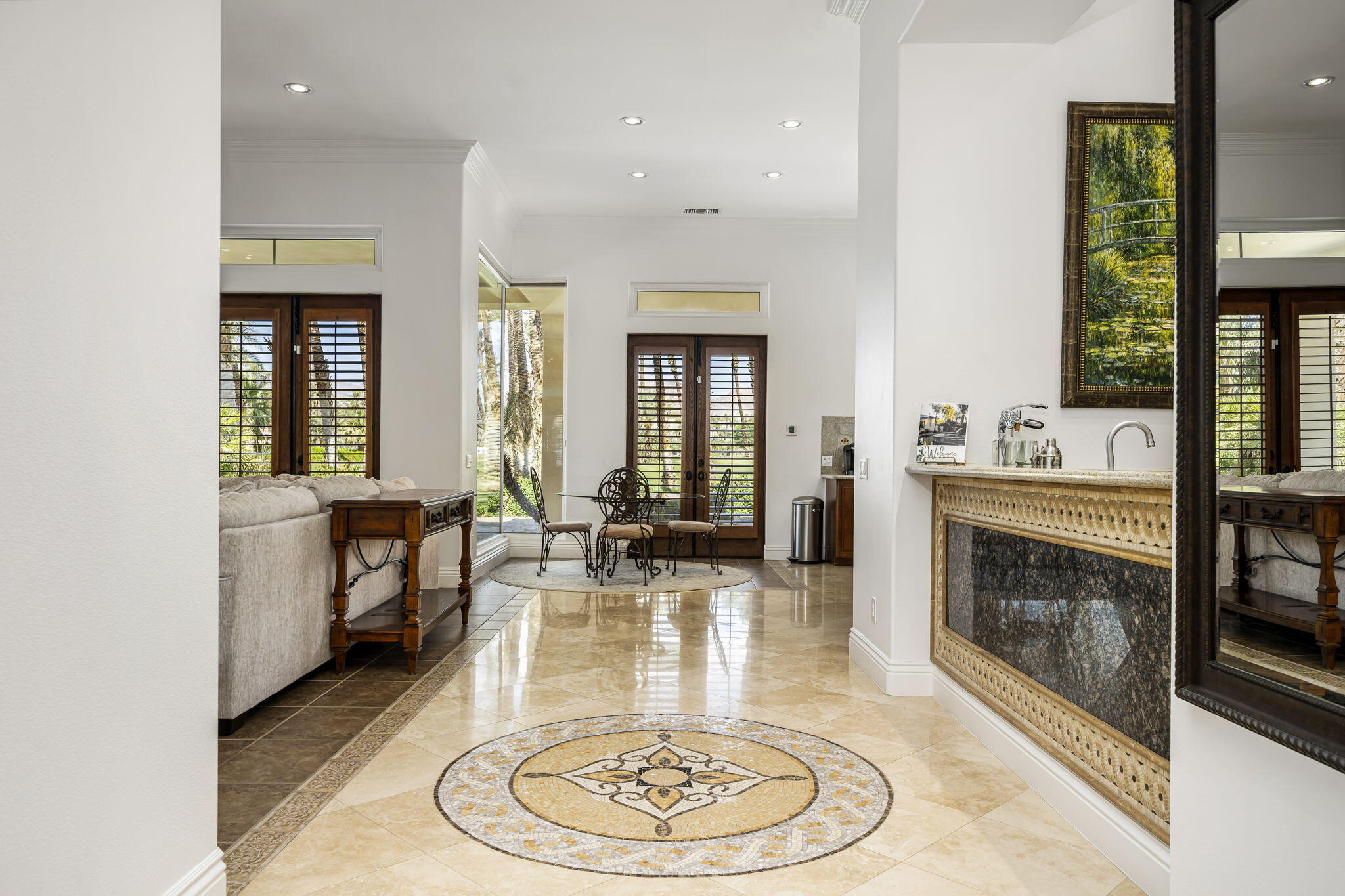 56985 Village Drive La Quinta, CA 92253 - Photo 20 of 73 wooden floor with fireplace and dining area