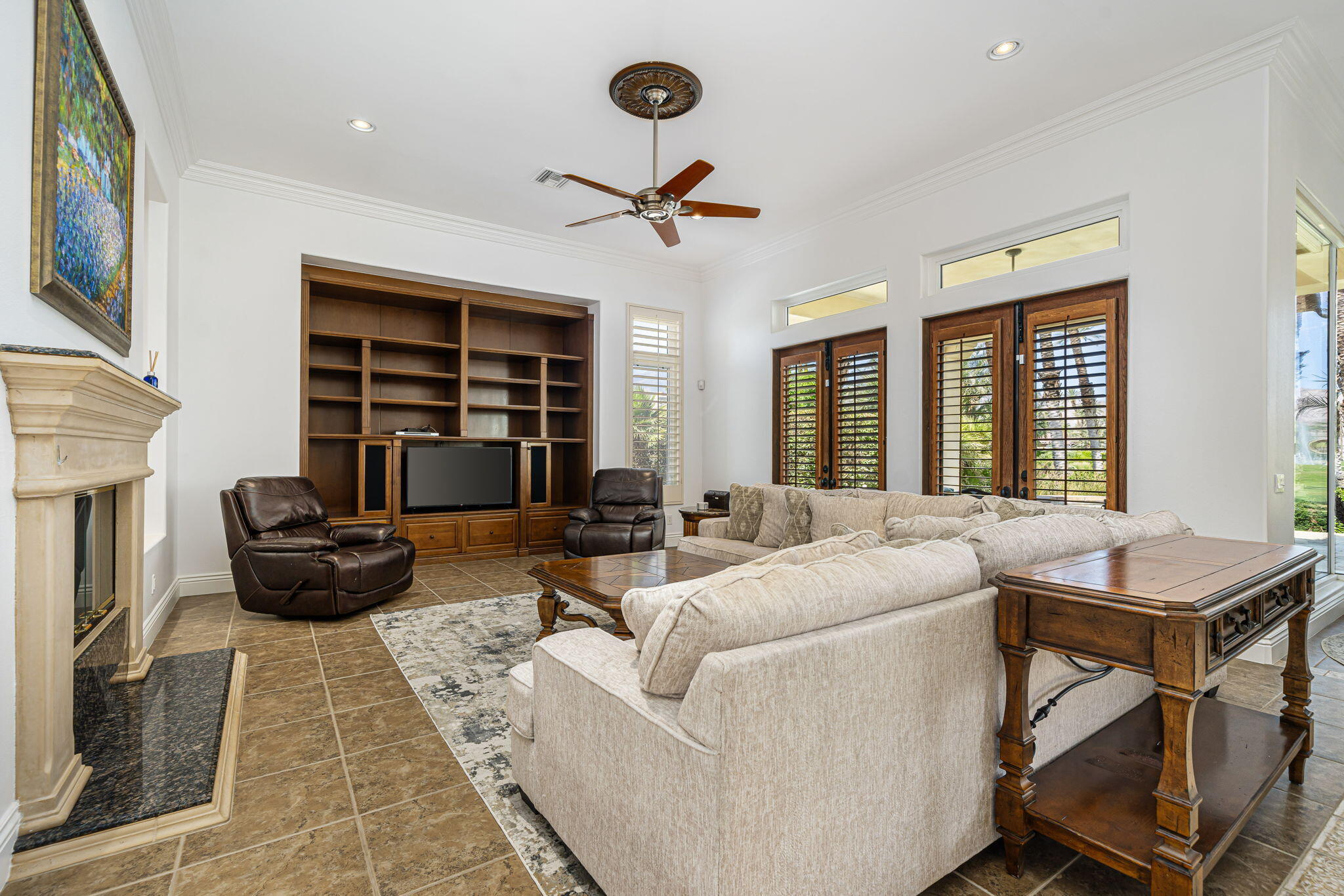 56985 Village Drive La Quinta, CA 92253 - Photo 24 of 73 a living room with furniture and a large window