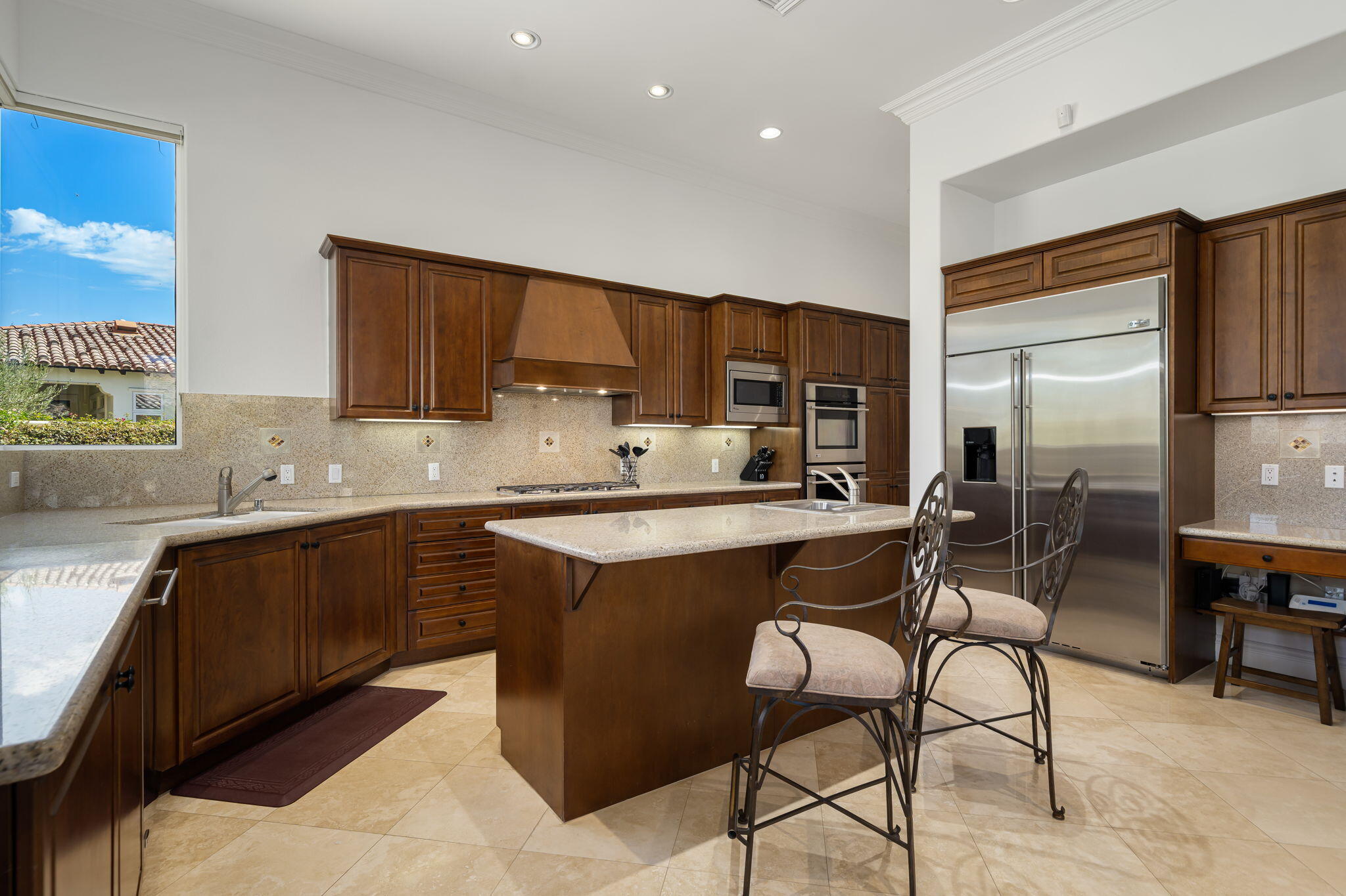 56985 Village Drive La Quinta, CA 92253 - Photo 29 of 73 a kitchen with a sink cabinets and window