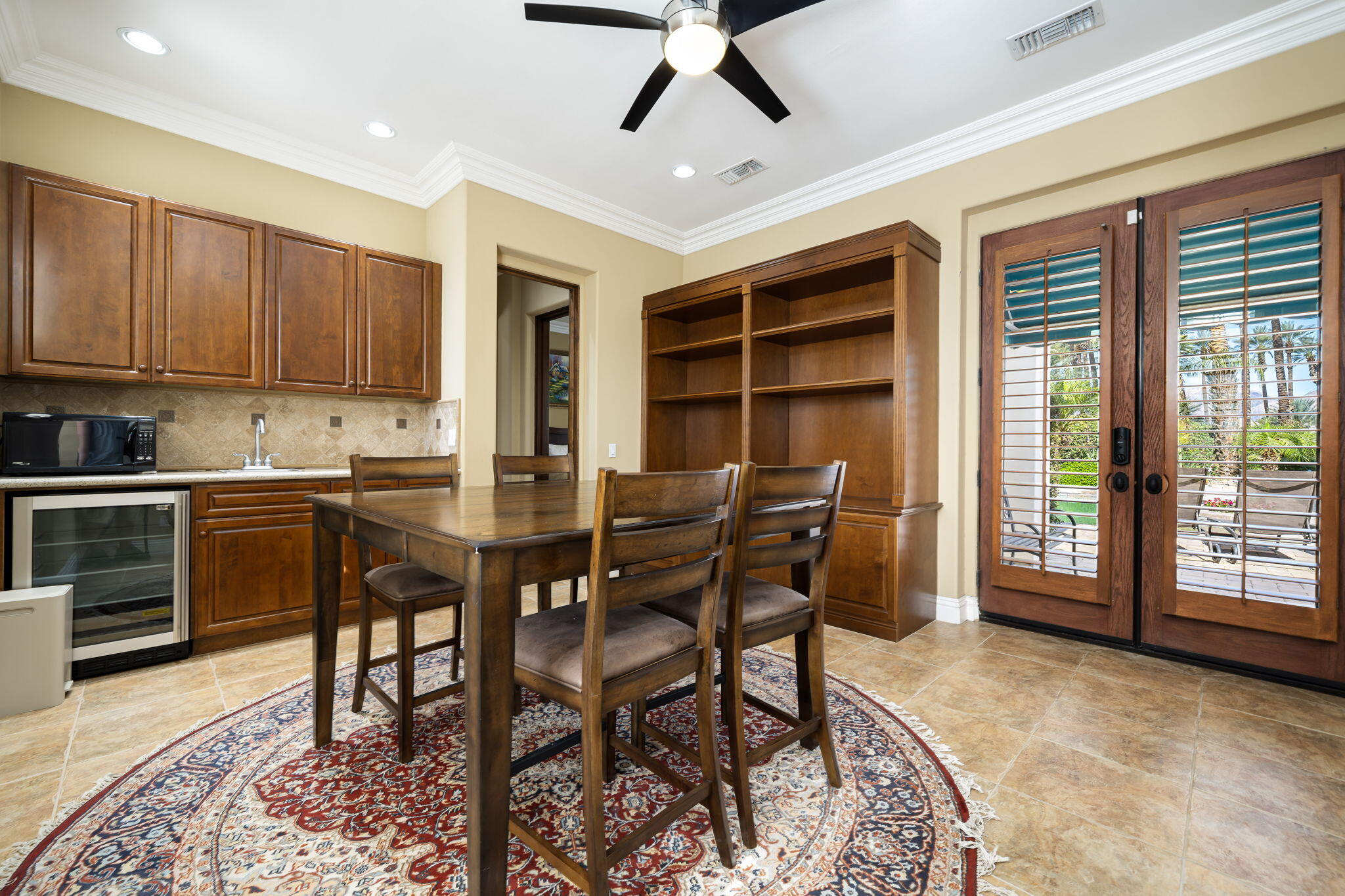 56985 Village Drive La Quinta, CA 92253 - Photo 48 of 73 a view of a dining room with furniture and a window