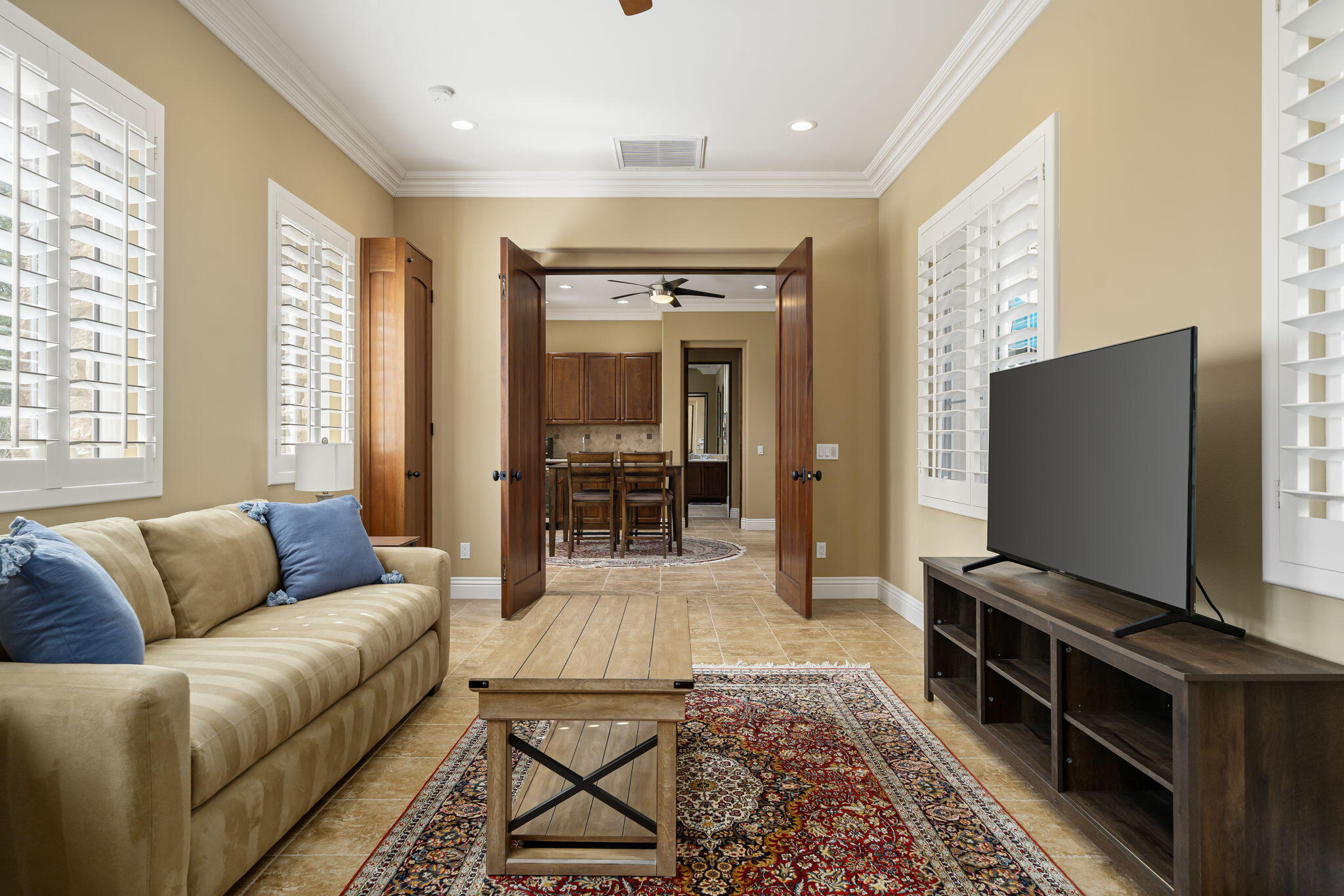 56985 Village Drive La Quinta, CA 92253 - Photo 52 of 73 a living room with furniture and a flat screen tv