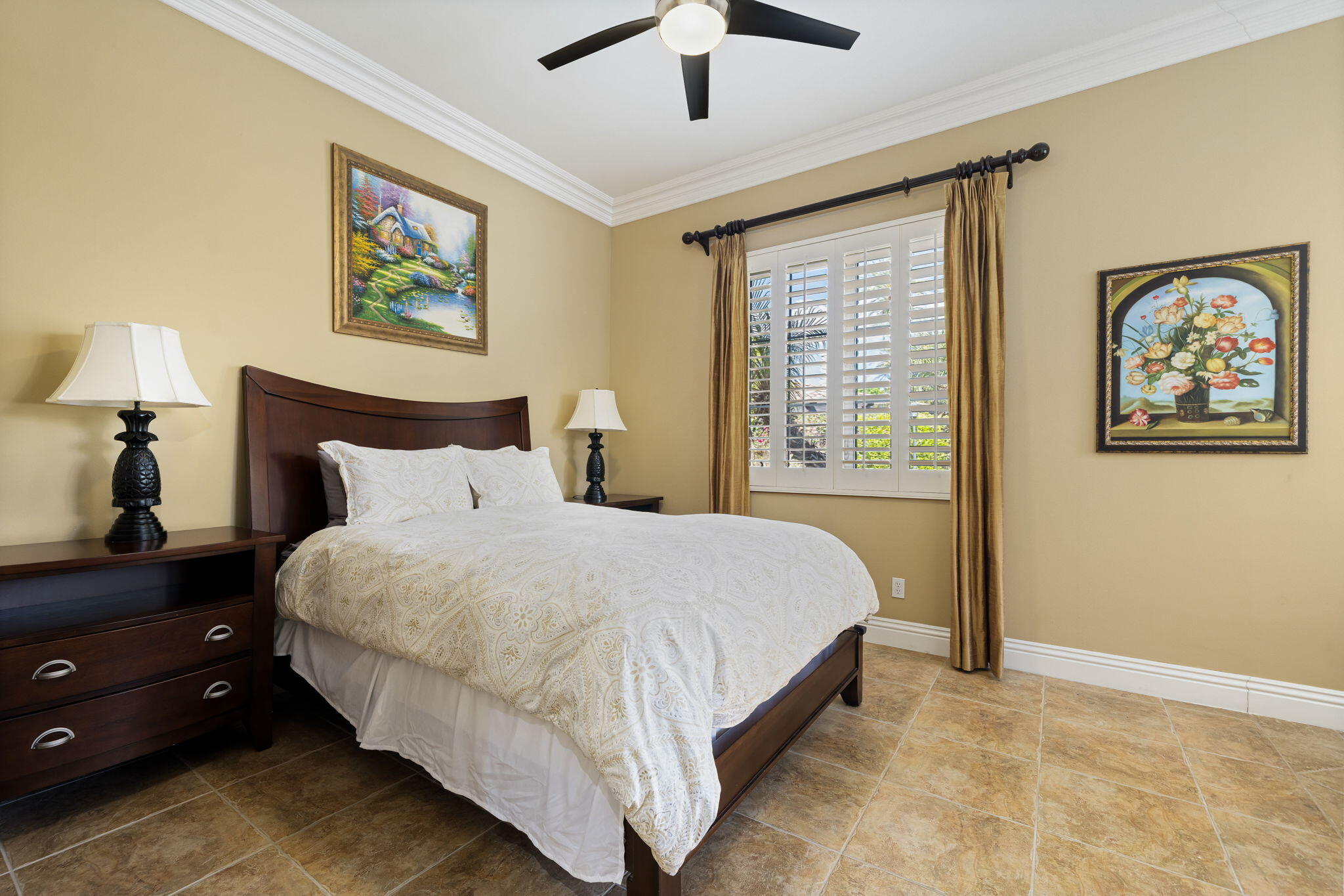 56985 Village Drive La Quinta, CA 92253 - Photo 53 of 73 a bedroom with bed and painting on the wall