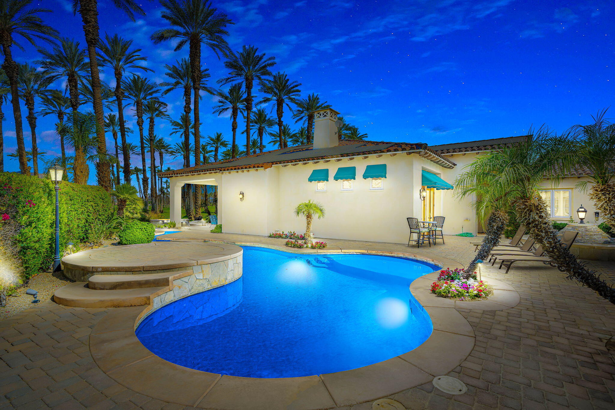 56985 Village Drive La Quinta, CA 92253 - Photo 59 of 73 a view of a swimming pool with a patio