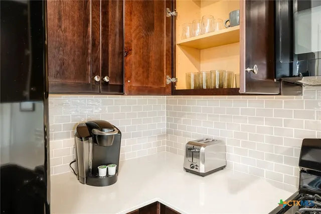 a bathroom with a sink a mirror and shower