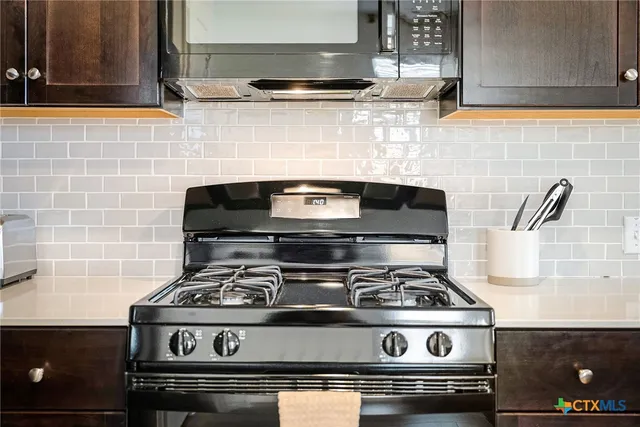 a kitchen with a sink and a gym equipment