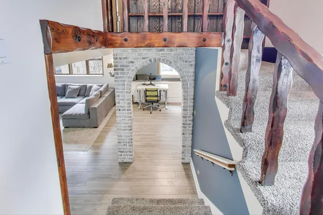 a bedroom with furniture and a ceiling fan