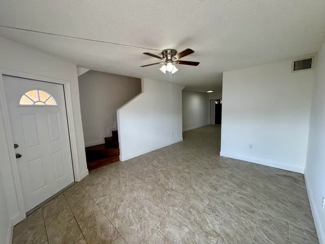 a view of a big room with carpet
