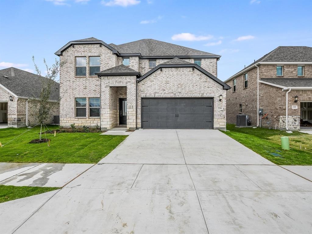2256 Bellatrix Drive Haslet, TX 76052 - Photo 1 of 24 a front view of a house with a yard