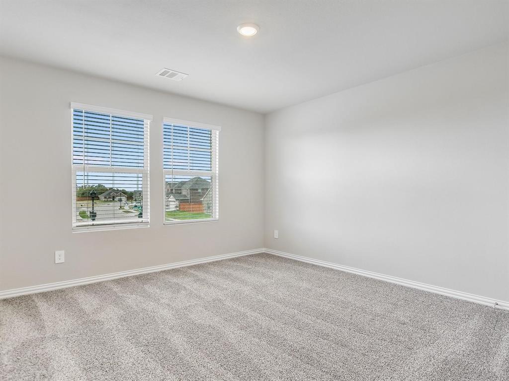 2256 Bellatrix Drive Haslet, TX 76052 - Photo 15 of 24 an empty room with windows