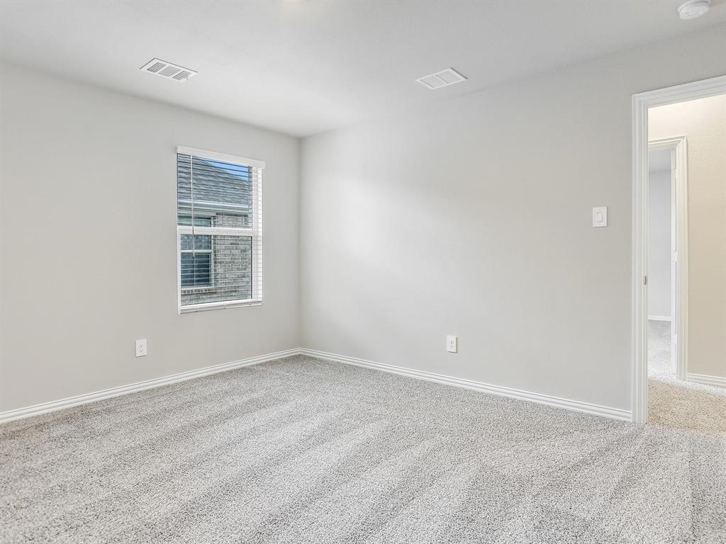 2256 Bellatrix Drive Haslet, TX 76052 - Photo 17 of 24 a view of an empty room with a window