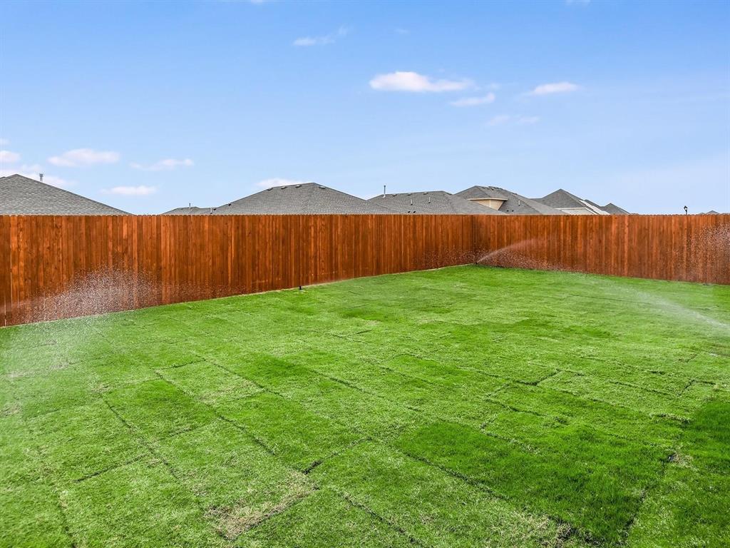 2256 Bellatrix Drive Haslet, TX 76052 - Photo 19 of 24 a view of yard with swimming pool and wooden fence