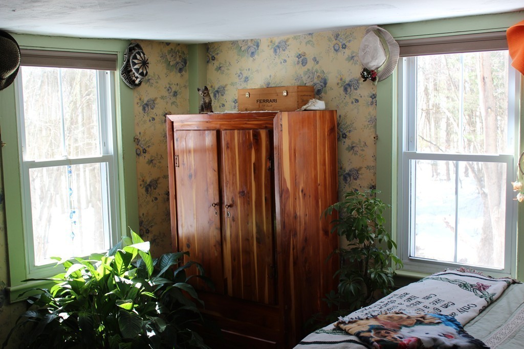 280 Somers Road Hampden, MA 01036 - Photo 17 of 30 a bedroom with a bed plant and a window