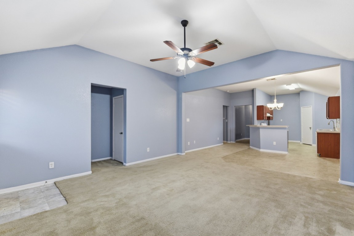 16763 North Blue Jay Drive Conroe, TX 77385 - Photo 11 of 26 a view of an empty room with a ceiling fan