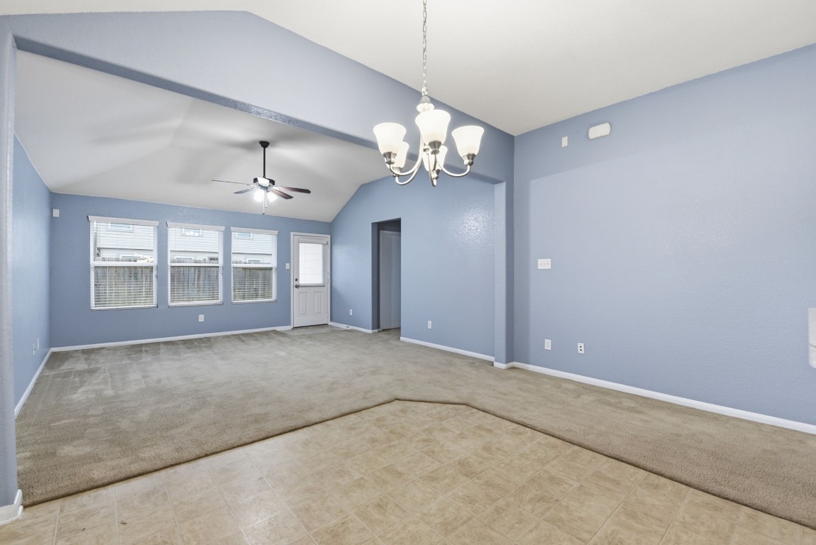 16763 North Blue Jay Drive Conroe, TX 77385 - Photo 12 of 26 a view of an empty room with a chandelier