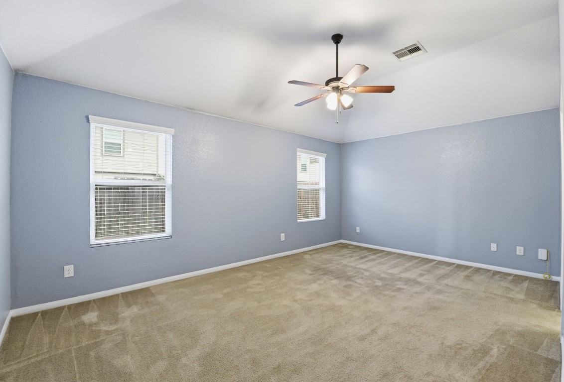 16763 North Blue Jay Drive Conroe, TX 77385 - Photo 14 of 26 an empty room with windows and fan