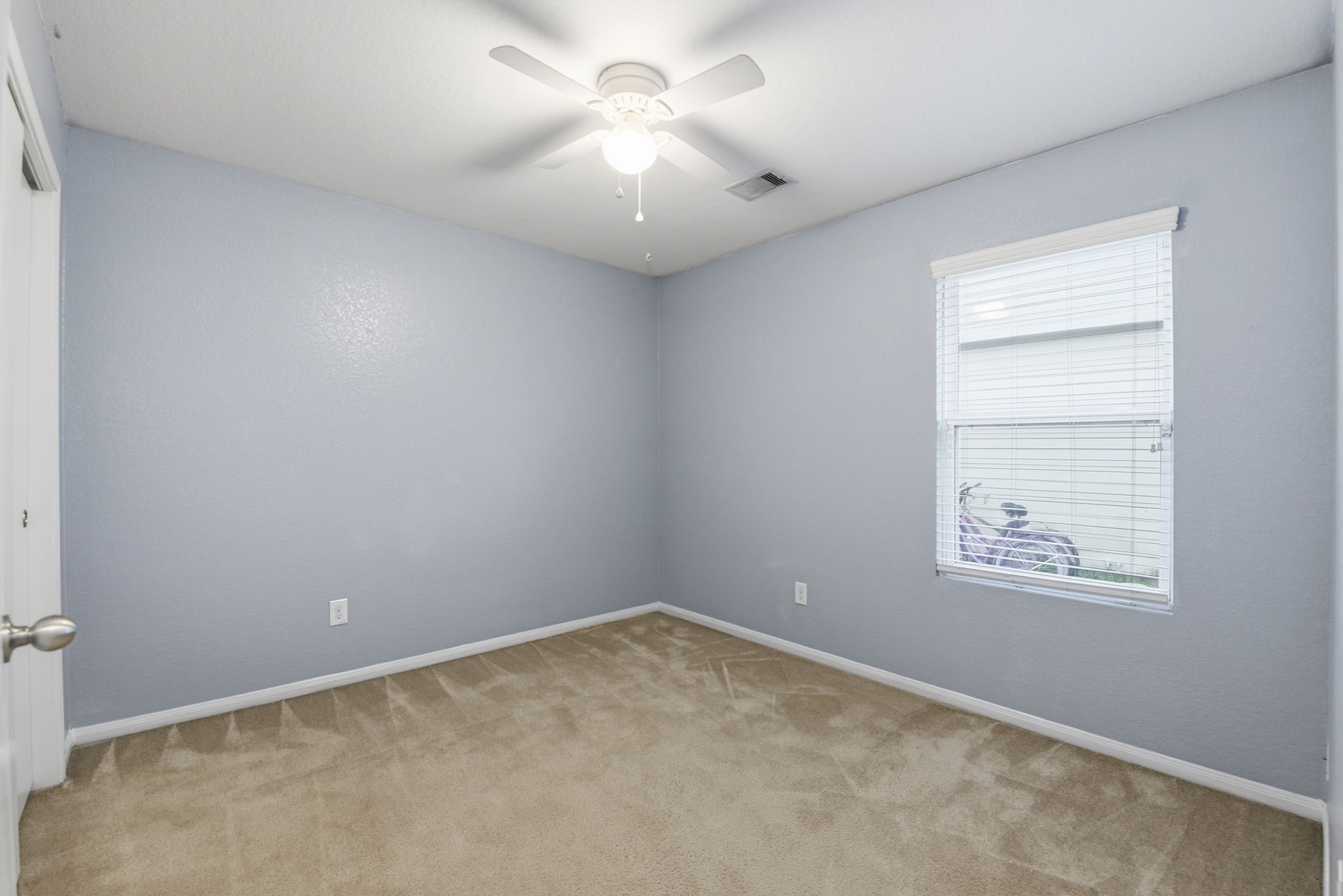16763 North Blue Jay Drive Conroe, TX 77385 - Photo 20 of 26 an empty room with windows and fan
