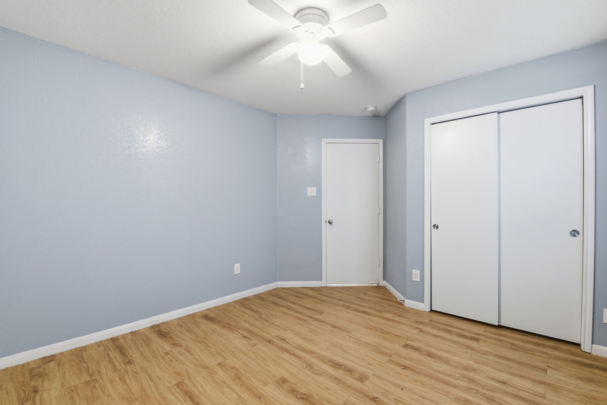 16763 North Blue Jay Drive Conroe, TX 77385 - Photo 22 of 26 a view of empty room with wooden floor and fan