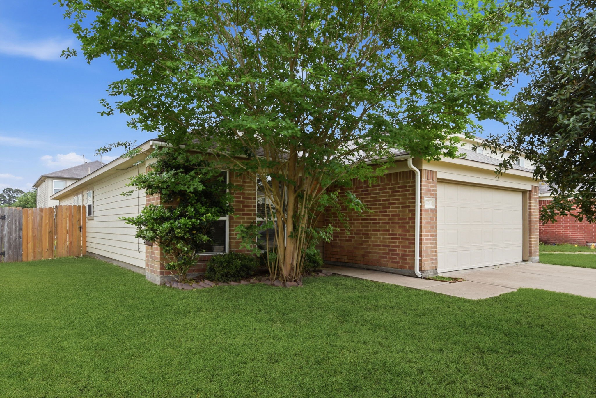 16763 North Blue Jay Drive Conroe, TX 77385 - Photo 3 of 26 front view of a house with a yard
