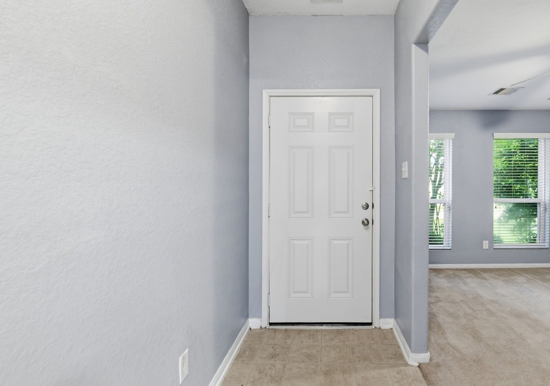 16763 North Blue Jay Drive Conroe, TX 77385 - Photo 4 of 26 an empty room with windows and closet