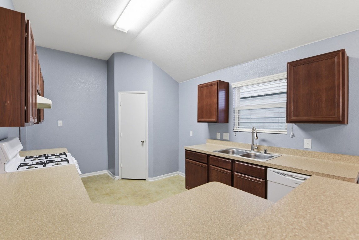 16763 North Blue Jay Drive Conroe, TX 77385 - Photo 8 of 26 a bedroom with a bed and a dresser