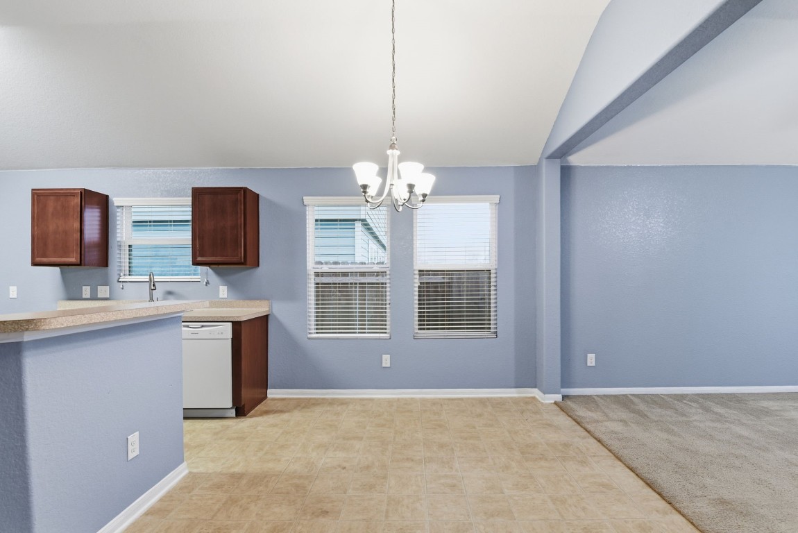 16763 North Blue Jay Drive Conroe, TX 77385 - Photo 9 of 26 a view of a kitchen with a sink and dishwasher kitchen view