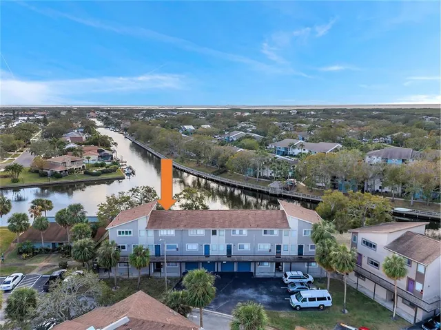 an aerial view of a house with a garden