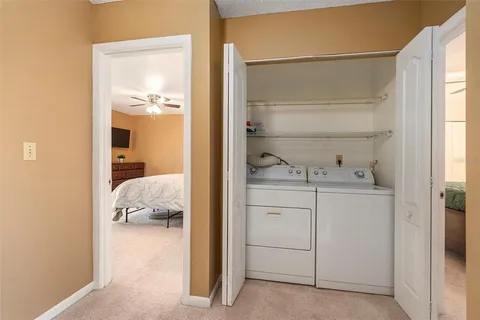a room with a bed and a cabinets