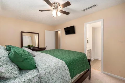 a bedroom with a large bed and a window